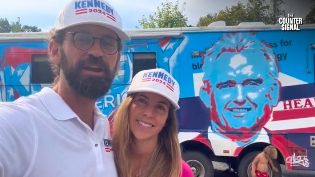 Kyle Kemper in front of the Robert F Kennedy Jr campaign bus that he is piloting. 